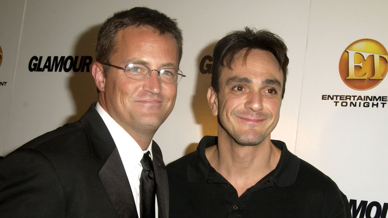 Matthew Perry posing for photos with Hank Azaria