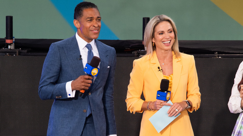 T.J. Holmes and Amy Robach before the firing