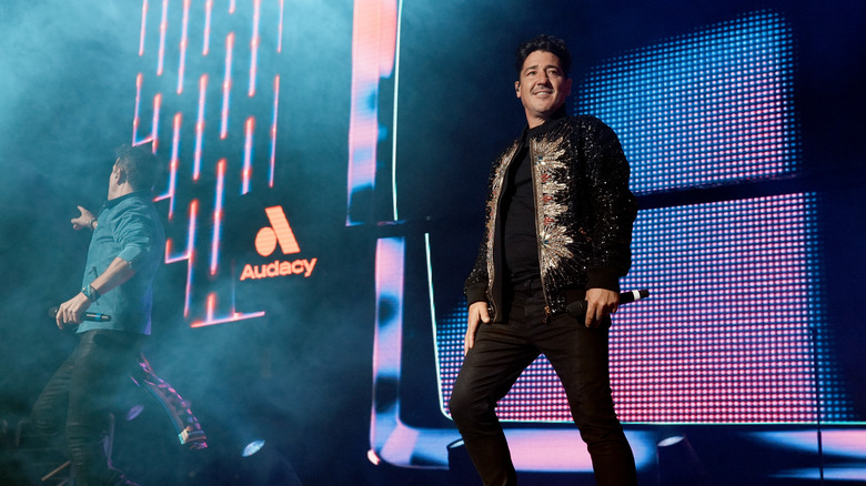 Jonathan Knight performing on stage