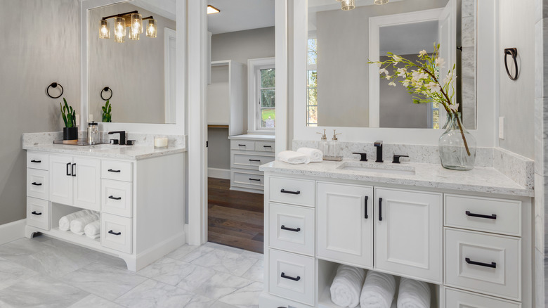 white on white bathroom with two vanities 