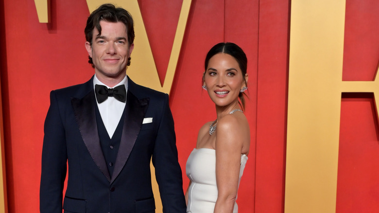 Olivia Munn and John Mulaney smile at the 30th Vanity Fair Oscar Party (2024)