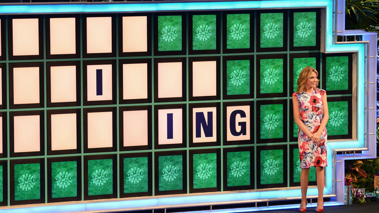 Vanna White and Wheel of Fortune board