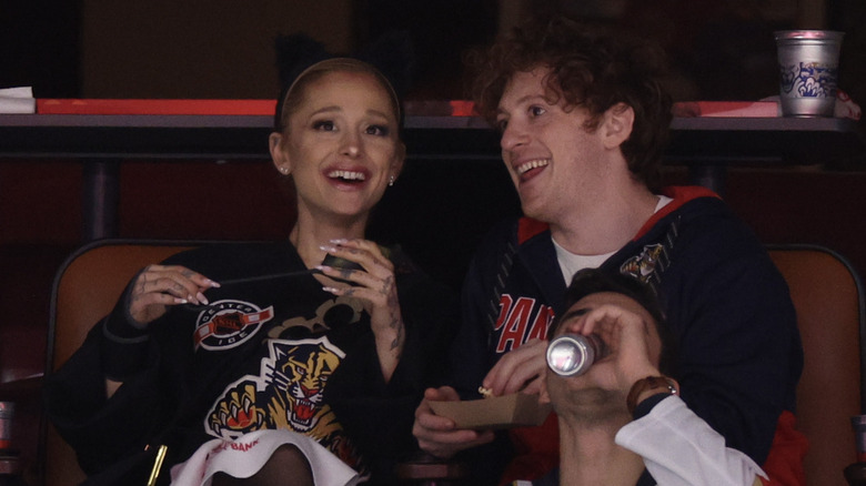 Ariana Grande and Ethan Slater smiling