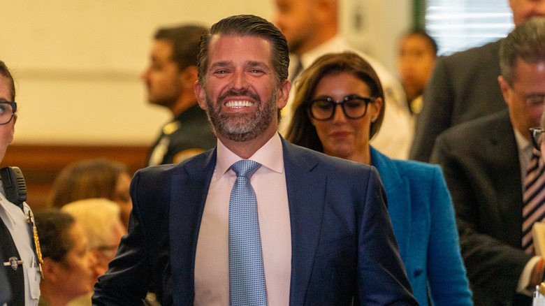 donald trump jr. smiles going to court