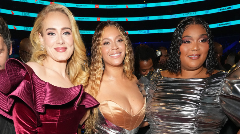 Adele, Beyoncé, and Lizzo posing at the 65th Grammy Awards at Crypto.com Arena in February 2023