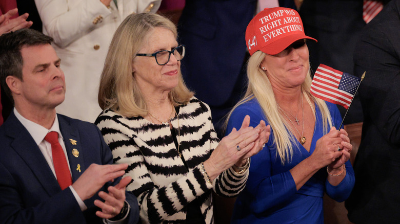 Marjorie Taylor Greene holds a flag at President Trump's joint address to Congress