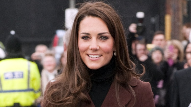 Kate Middleton wearing black and brown outfit