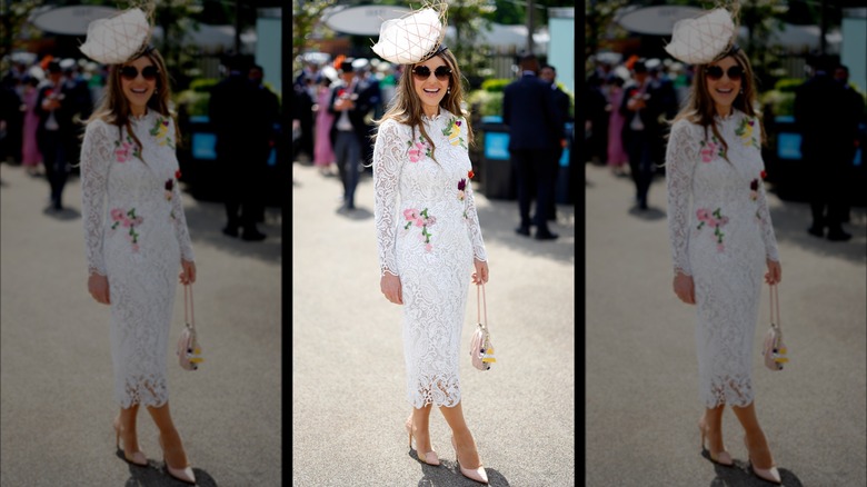 Elizabeth Hurley is floral-appliqued dress and basket hat