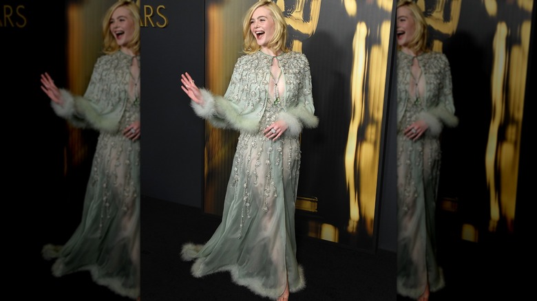 Elle Fanning waving on red carpet