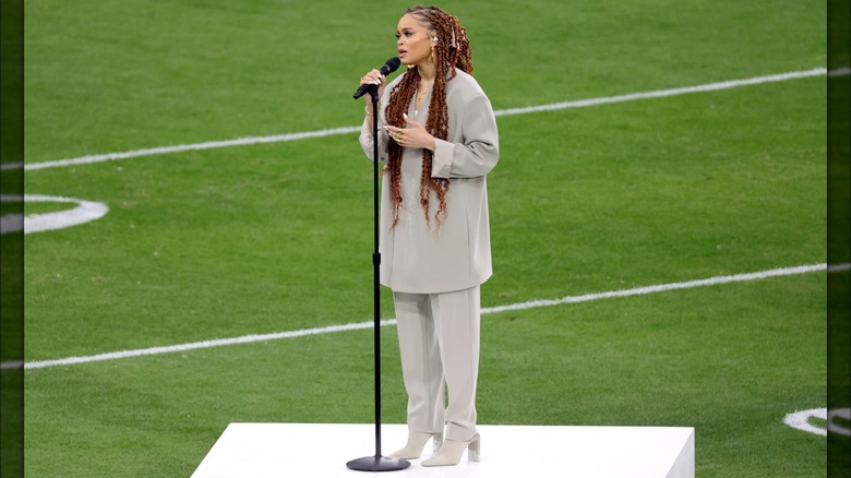 Andra Day on the football field