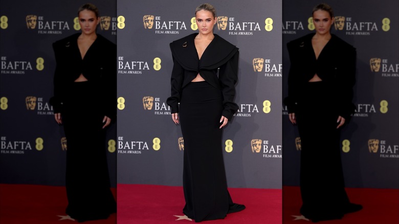 Molly-Mae Hague posing in a black two-piece outfit at the 2025 BAFTA Awards