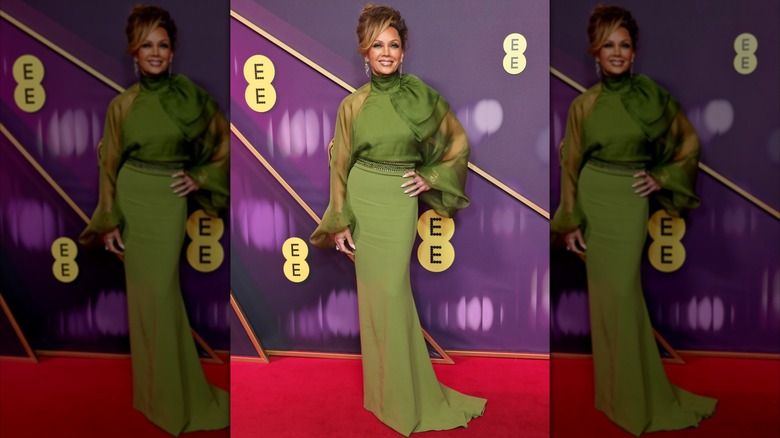 Vanessa Williams posing in a green dress at the 2025 BAFTA Awards