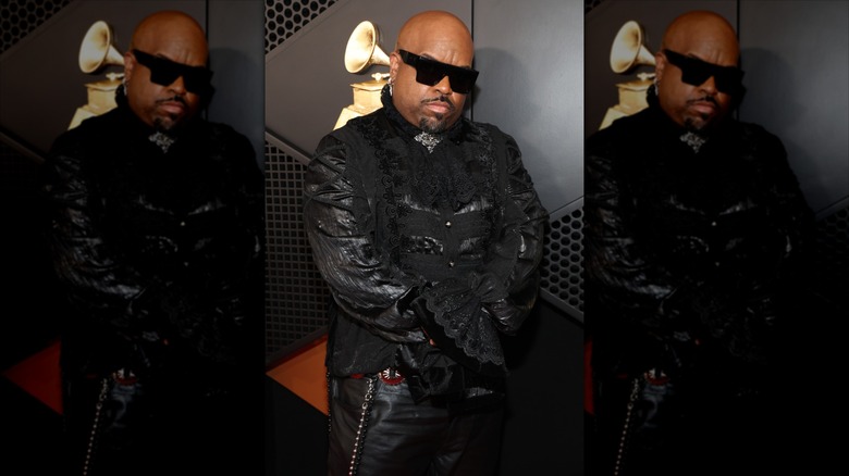 CeeLo Green posing in black lacy, ruffled outfit