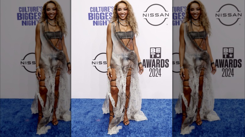 Tinashe in shredded dress and wrapped cording