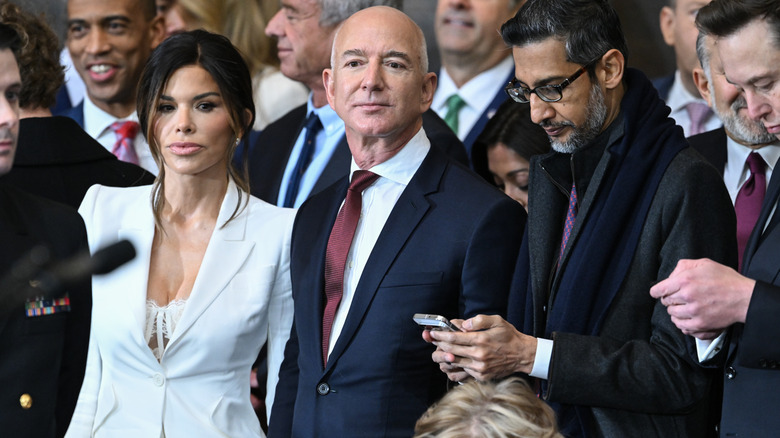 Lauren Sanchez and Jeff Bezos staring