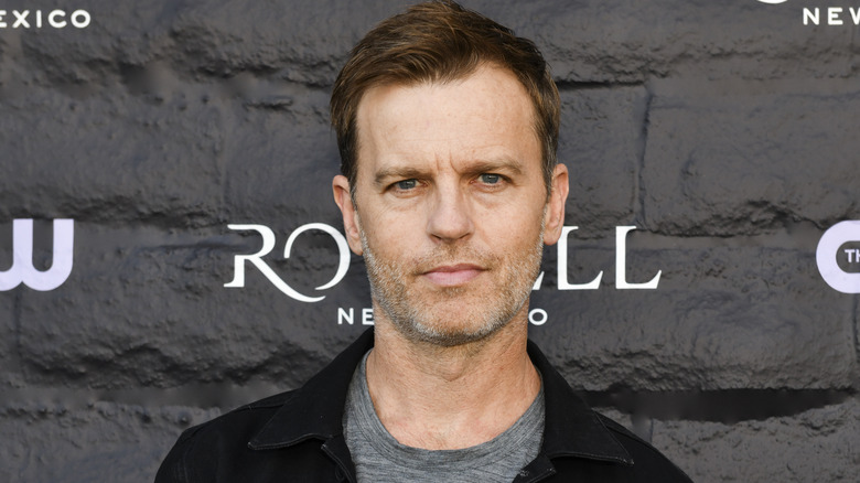 Trevor St. John posing on the red carpet