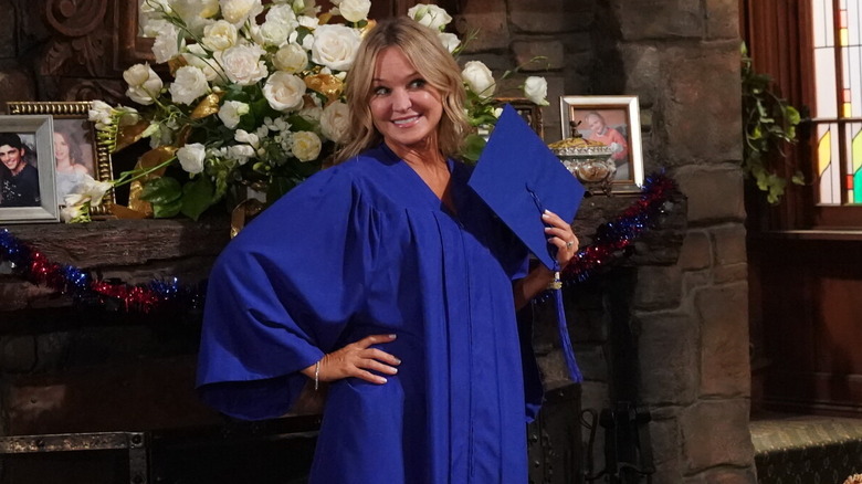 Sharon Case posing for a graduation photo as Sharon Newman