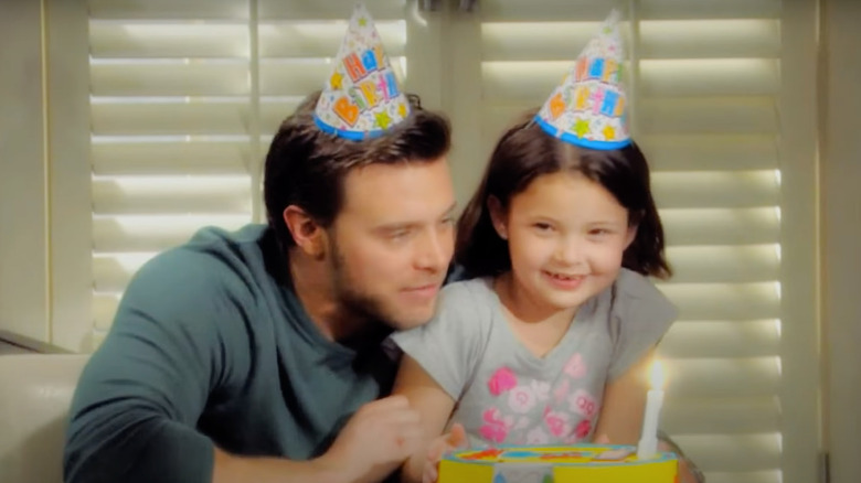 Billy and Delia wearing birthday hats