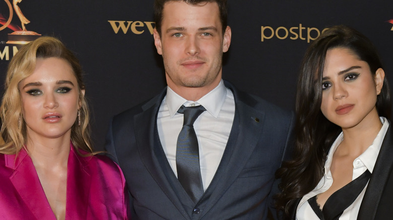 Hunter King, Michael Mealor, and Sasha Calle Summer Kyle Lola of The Young and the Restless posing on the red carpet