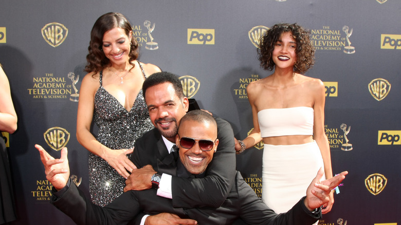 Kristoff St. John goofing around with some costars on the red carpet