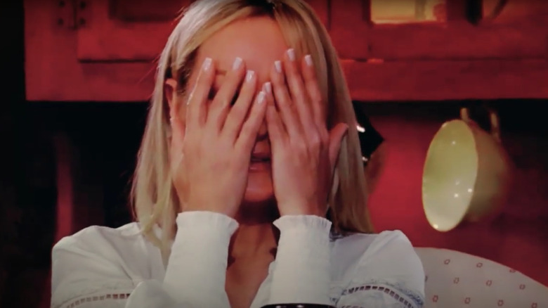 Sharon covering her eyes with her hands