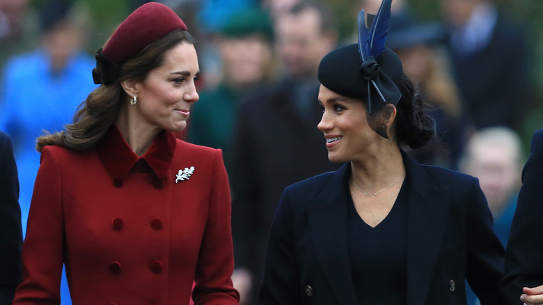 Meghan Markle and Princess Catherine talking 