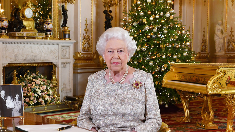 Queen Elizabeth posing on Christmas Eve