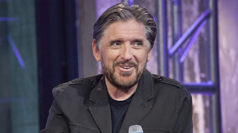 Craig Ferguson on stage holding mic