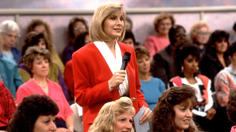 Jenny Jones holding mic in audience