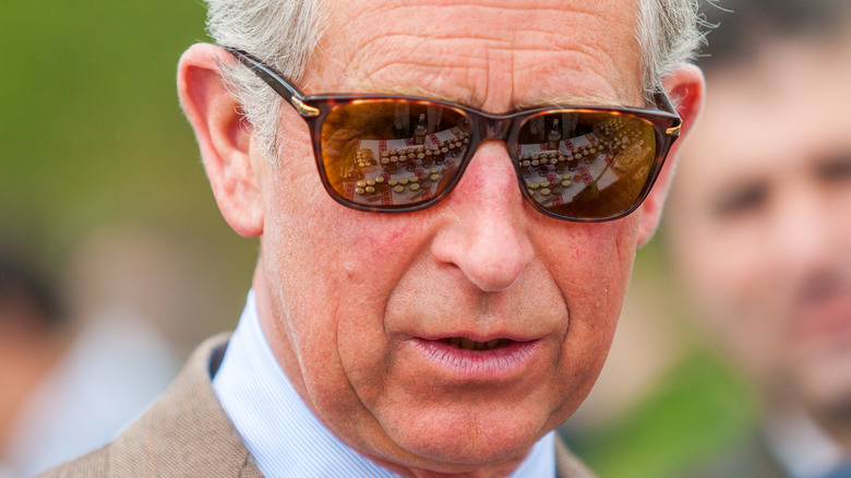 King Charles III wearing sunglasses