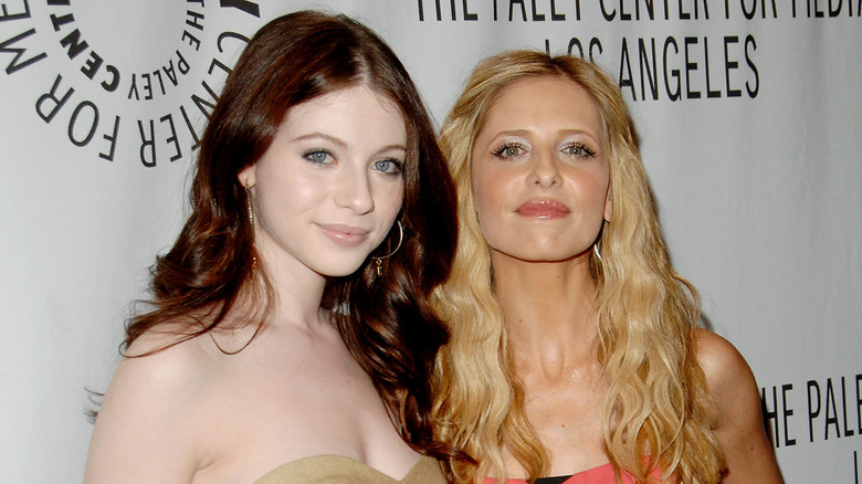 Michelle Trachtenberg posing with Sarah Michelle Gellar