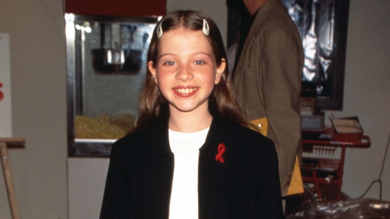 Young Michelle Trachtenberg smiling 