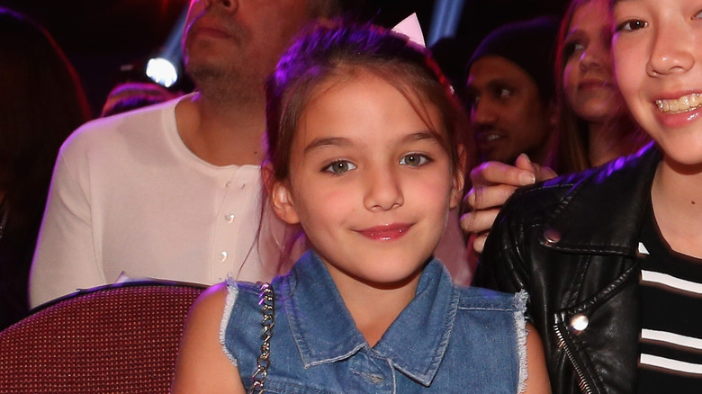 Suri Cruise as a child smiling 