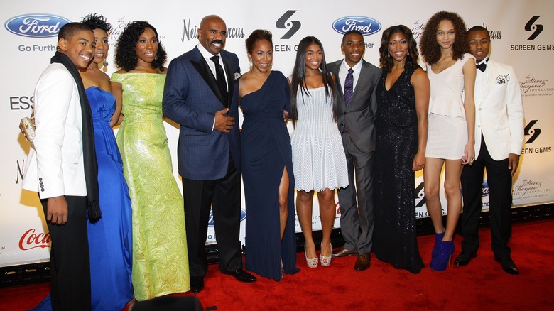 Steve and Marjorie Harvey posing with Steve's kids