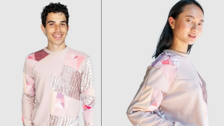 Models wearing pink gender-neutral sweatshirt