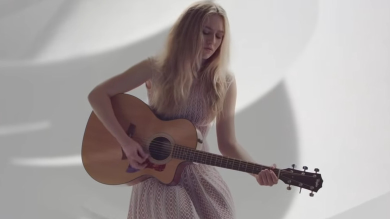 Maggie Sajak playing guitar music video