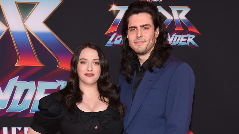 Kat Dennings and Andrew W.K. posing at a premiere