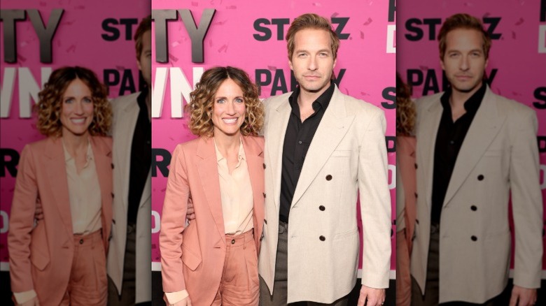 Ryan Hansen and his wife on a red carpet