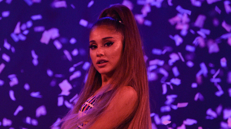 Ariana Grande on stage in front of confetti