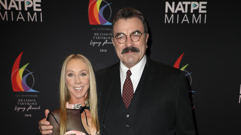 Tom Selleck and Jillie Mack on a red carpet 