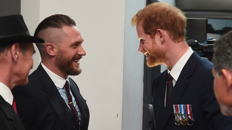 Harry and Tom Hardy chatting 