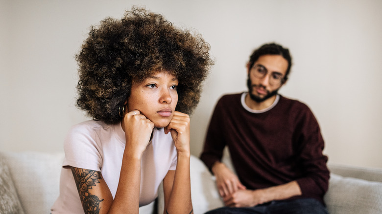 a seated upset couple 