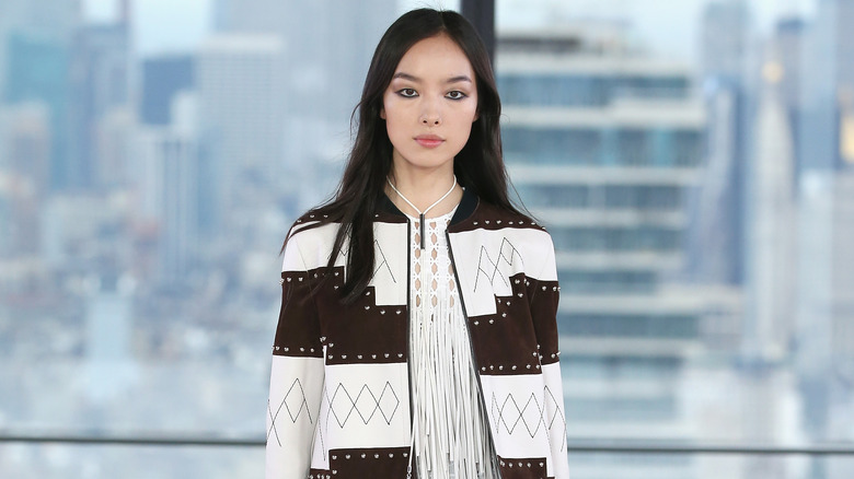 Fei Fei Sun modeling at the 2019 Longchamp Spring Show