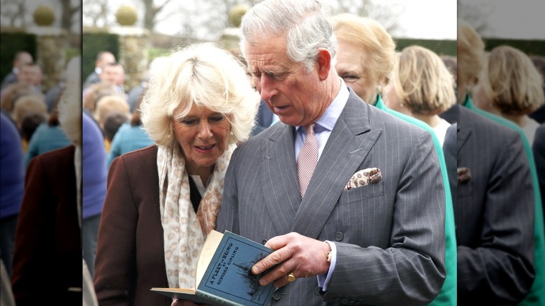 Prince Charles reading a book