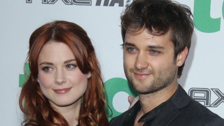 Alexandra Breckenridge and husband posing