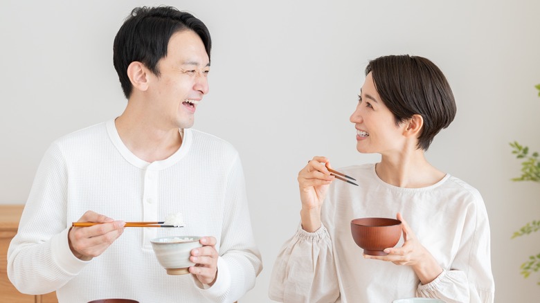Asian couple enjoying a meal