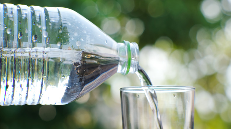 bottle of water and a glass