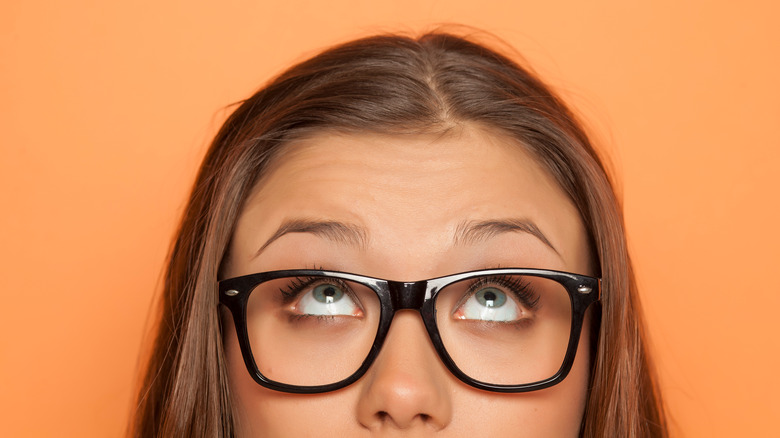 Woman looking up at her forehead