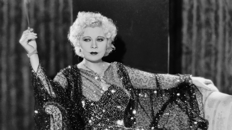 Portrait of Mae West smoking