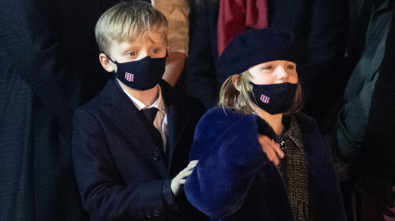 Prince Jacques and Princess Gabriella wearing masks